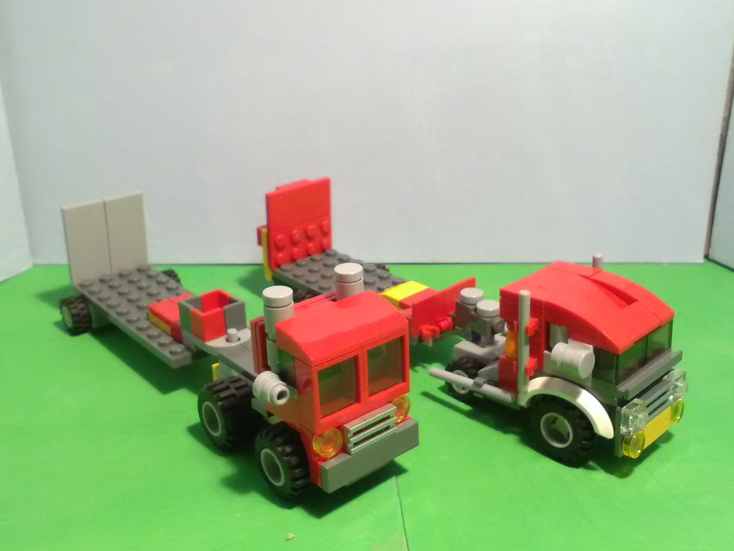 2 red trucks and trailers