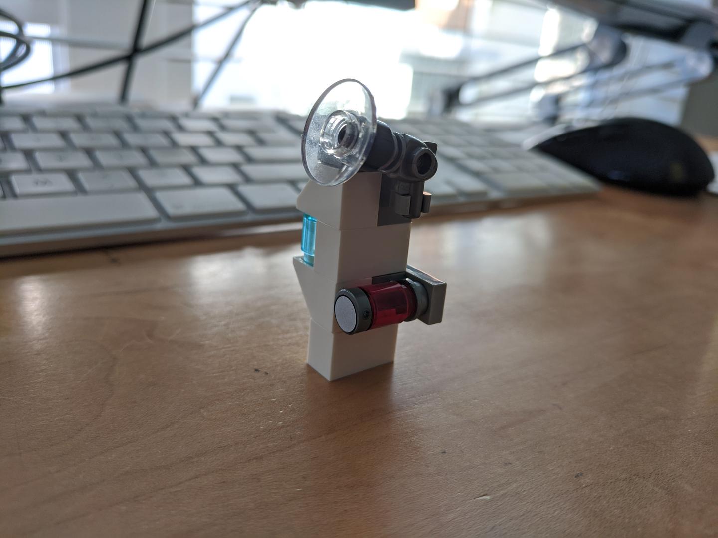 Lego Hall of Armor Style Holder for Ant-Man's Belongings.