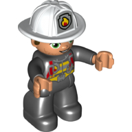Duplo Figure with Helmet, Black Legs, Black Jacket with Red Safety Harness, White Helmet with Silver Fire Badge, Green Eyes, Stubble (Firefighter)