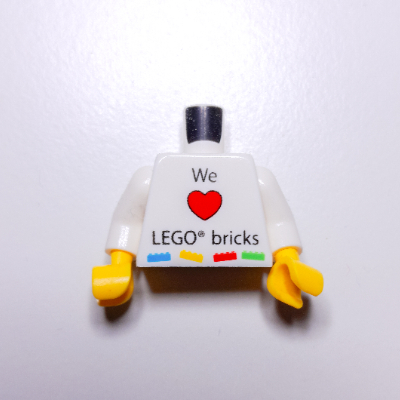 LEGO part Torso with 'We Heart LEGO bricks' / LEGO Logo, 'KLADNO LEGO Production s.r.o.' Print, White Arms, Yellow Hands