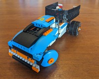 Boosted dump truck
