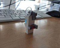 Lego Hall of Armor Style Holder for Ant-Man's Belongings.