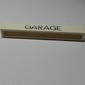 Brick 1 x 8 without Bottom Tubes with Cross Side Supports with 'GARAGE' Thin Narrow Black Print