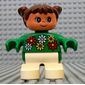Duplo Figure, Early Child, with Pigtails Brown, White Legs, White, Red and Yellow Flowers