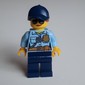 Policewoman Sam Solo, Bright Light Blue Shirt with Radio and Badge, Dark Blue Legs, Dark Blue Cap with Hair, Sunglasses