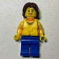 Woman, Orange Halter Top with Flowers, Blue Legs, Yellow Life Vest, Dark Brown Hair