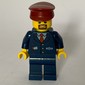 Train Conductor, Dark Blue Suit with Tie and Train Logo, Dark Red Hat, Goatee Beard