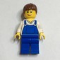 Woman, Blue Overalls over White V-Neck Shirt, Reddish Brown Hair