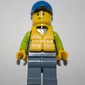 Man, Black and Lime Jacket, Blue Cap, Yellow Life Vest